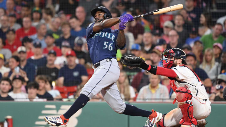 Seattle Mariners left fielder Randy Arozarena hits a home run against the Boston Red Sox on Monday at Fenway Park.