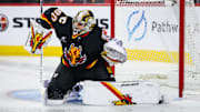 Jan 2, 2025; Calgary, Alberta, CAN; Calgary Flames goaltender Dan Vladar (80) makes a save against the Utah Hockey Club during the second period at Scotiabank Saddledome. Mandatory Credit: Sergei Belski-Imagn Images