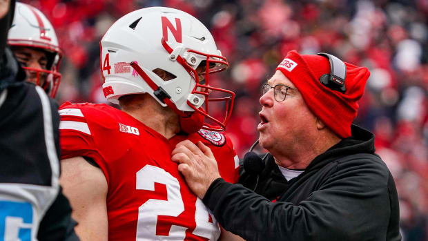 Nebraska Cornhuskers assistant coach Ed Foley talks to tight end Thomas Fidone II (24) 