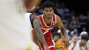 Mar 21, 2025; Cleveland, OH, USA;  New Mexico Lobos guard Donovan Dent (2) dribbles in the second half against the Marquette Golden Eagles during the NCAA Tournament First Round at Rocket Arena. Mandatory Credit: Rick Osentoski-Imagn Images