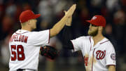 Apr 11, 2016; Washington, DC, USA; Washington Nationals relief pitcher Jonathan Papelbon (58) and right fielder Bryce Harper (34) celebrate on the field after defeating Atlanta Braves 6-4 at Nationals Park. Mandatory Credit: Tommy Gilligan-USA TODAY Sports