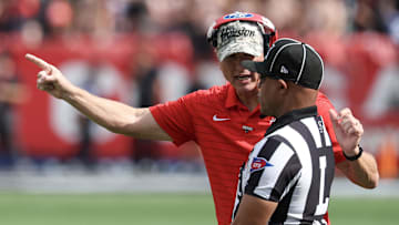 Nov 1, 2025; Houston, Texas, USA; Houston Cougars head coach Willie Fritz talks to an official while playing against the West Virginia Mountaineers  in the second half at TDECU Stadium. Mandatory Credit: Thomas Shea-Imagn Images