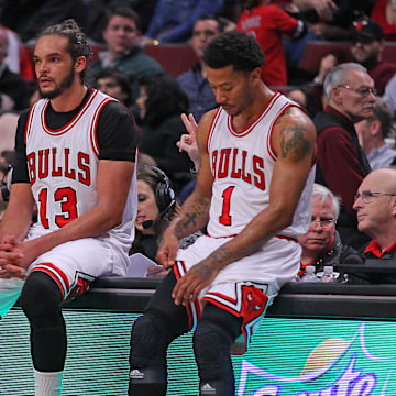 Chicago Bulls guard Jimmy Butler (21), center Joakim Noah (13), and guard Derrick Rose (1) during the second half against the Phoenix Suns at the United Center. 