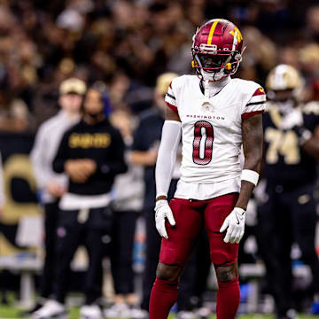 Dec 15, 2024; New Orleans, Louisiana, USA;  Washington Commanders cornerback Mike Sainristil (0) looks on against the New Orleans Saints during the first half at Caesars Superdome. Mandatory Credit: Stephen Lew-Imagn Images