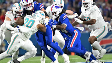 Sep 18, 2025; Orchard Park, New York, USA; Buffalo Bills running back James Cook (4) runs against the Miami Dolphins in the first quarte at Highmark Stadium. Mandatory Credit: Mark Konezny-Imagn Images