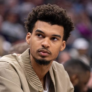 Mar 7, 2025; Sacramento, California, USA; San Antonio Spurs center Victor Wembanyama (1) looks on from the bench during the fourth quarter of the game against the Sacramento Kings at Golden 1 Center. Mandatory Credit: Ed Szczepanski-Imagn Images