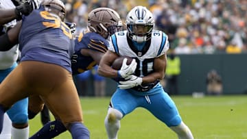 Nov 2, 2025; Green Bay, Wisconsin, USA; Carolina Panthers running back Chuba Hubbard (30) runs during the first half against the Green Bay Packers at Lambeau Field. Mandatory Credit: Jeff Hanisch-Imagn Images