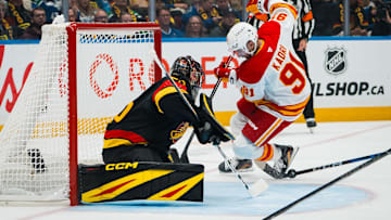 Oct 9, 2025; Vancouver, British Columbia, CAN; Vancouver Canucks goalie Thatcher Demko (35) makes a save on Calgary Flames forward Nazem Kadri (91) in the first period at Rogers Arena. Mandatory Credit: Bob Frid-Imagn Images