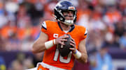 Sep 7, 2025; Denver, Colorado, USA; Denver Broncos quarterback Bo Nix (10) drops back to pass against the Tennessee Titans in the first half at Empower Field at Mile High. 