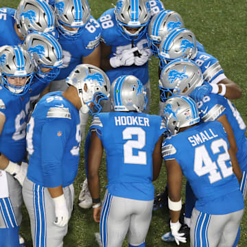 Detroit Lions huddle in the third quarter against the Los Angeles Chargers at Tom Benson Hall of Fame Stadium