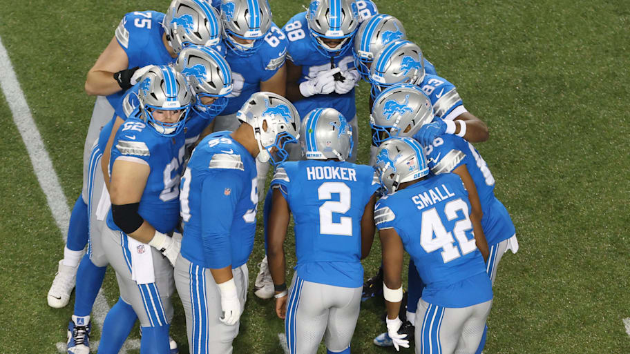 Detroit Lions huddle in the third quarter against the Los Angeles Chargers at Tom Benson Hall of Fame Stadium | Scott Galvin-Imagn Images