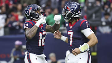 Jan 13, 2024; Houston, Texas, USA; Houston Texans wide receiver Nico Collins (12) celebrates with quarterback C.J. Stroud (7) after a touchdown in a 2024 AFC wild card game against the Cleveland Browns at NRG Stadium. Mandatory Credit: Troy Taormina-Imagn Images