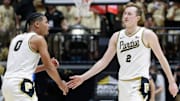 Purdue Boilermakers guard C.J. Cox (0) high-fives Purdue Boilermakers guard Fletcher Loyer (2)