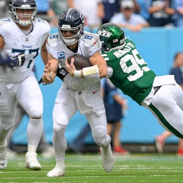 Sep 15, 2024; Nashville, Tennessee, USA;  New York Jets defensive end Will McDonald IV (99) tackles Tennessee Titans quarterback Will Levis (8) for a loss during the first half at Nissan Stadium. 