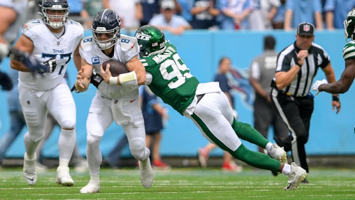 Sep 15, 2024; Nashville, Tennessee, USA;  New York Jets defensive end Will McDonald IV (99) tackles Tennessee Titans quarterback Will Levis (8) for a loss during the first half at Nissan Stadium. 