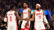 Nov 26, 2025; San Francisco, California, USA;  Houston Rockets guard Aaron Holiday (0), guard-forward Amen Thompson (1), and guard Josh Okogie (20) huddle during a break in the action against the Golden State Warriors in the fourth quarter at Chase Center. Mandatory Credit: David Gonzales-Imagn Images