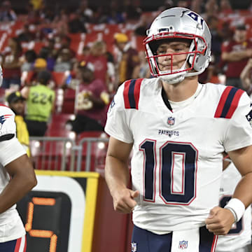 Aug 25, 2024; Landover, Maryland, USA;  New England Patriots quarterback Drake Maye (10) takes the field before the game against the Washington Commanders at Commanders Field. Mandatory Credit: Tommy Gilligan-USA TODAY Sports