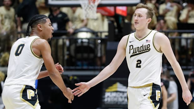 Purdue Boilermakers guard C.J. Cox (0) high-fives guard Fletcher Loyer (2)