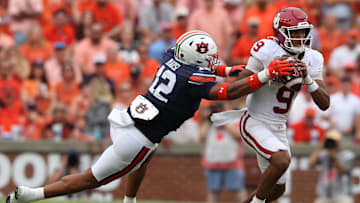 Sep 28, 2024; Auburn, Alabama, USA; Auburn Tigers linebacker Dorian Mausi Jr. (12) moves in to tackle Oklahoma Sooners quarterback Michael Hawkins Jr. (9) during the second quarter at Jordan-Hare Stadium. Mandatory Credit: John Reed-Imagn Images