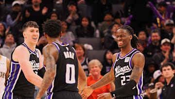 Feb 8, 2025; Sacramento, California, USA; Sacramento Kings forward Jake LaRavia (33), guard Malik Monk (0) and guard Keon Ellis (23) celebrate after a play against the New Orleans Pelicans during the fourth quarter at Golden 1 Center. Mandatory Credit: Kelley L Cox-Imagn Images