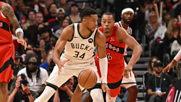 Oct 24, 2025; Toronto, Ontario, CAN; Milwaukee Bucks forward Giannis Antetokounmpo (34) is defended by Toronto Raptors forward Scottie Barnes (4) in the fourth quarter at Scotiabank Arena. Mandatory Credit: Gerry Angus-Imagn Images