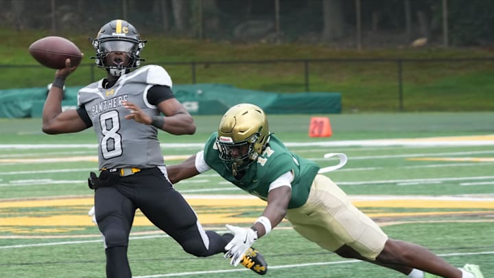 Montvale, NJ -- August 31, 2024 -- Quarterback Siren Edwards of St. Frances is chased by Thai Gray of St. Joseph in the first half. St. Frances Academy of Baltimore defeated St. Joseph Regional 31-21 in a game played in Montvale. St. Frances opens the 2025 season Aug. 23 against Madonna-Chaminade from Florida.