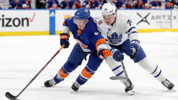 Jan 11, 2024; Elmont, New York, USA; New York Islanders defenseman Mike Reilly (2) fights for the