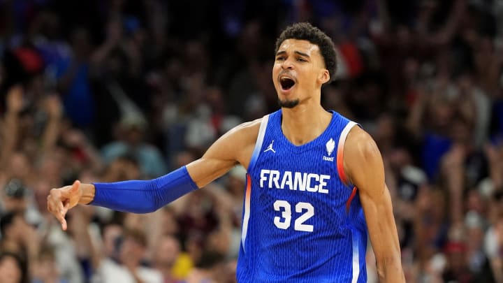 Jul 30, 2024; Villeneuve-d'Ascq, France; France power forward Victor Wembanyama (32) celebrates after defeating Japan in men’s basketball group B play during the Paris 2024 Olympic Summer Games at Stade Pierre-Mauroy. Mandatory Credit: John David Mercer-USA TODAY Sports