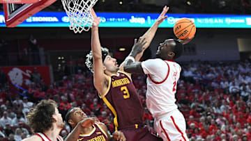 Mar 1, 2025; Lincoln, Nebraska, USA;  Nebraska Cornhuskers forward Juwan Gary (4) attempts a shot over Minnesota Golden Gophers forward Dawson Garcia (3) during the first half at Pinnacle Bank Arena.