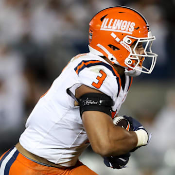 Sep 28, 2024; University Park, Pennsylvania, USA; Illinois Fighting Illini running back Kaden Feagin (3) runs during the second quarter against the Penn State Nittany Lions at Beaver Stadium. Mandatory Credit: Matthew O'Haren-Imagn Images