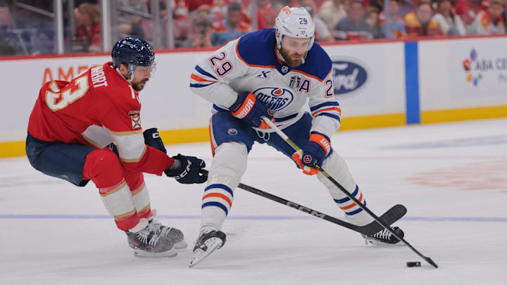 Jun 9, 2025; Sunrise, Florida, USA; Edmonton Oilers center Leon Draisaitl (29) controls the puck against Florida Panthers forward Sam Reinhart (13) during the first period in game three of the 2025 Stanley Cup Final at Amerant Bank Arena. Mandatory Credit: Sam Navarro-Imagn Images