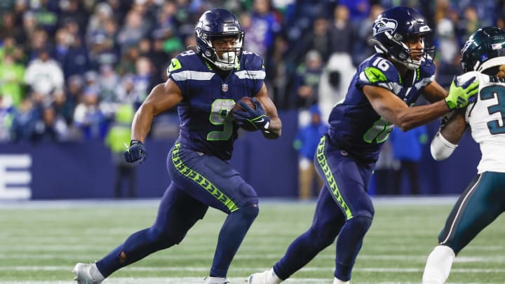 Dec 18, 2023; Seattle, Washington, USA; Seattle Seahawks running back Kenneth Walker III (9) rushes against the Philadelphia Eagles during the fourth quarter at Lumen Field.