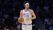 Apr 7, 2025; Miami, Florida, USA; Miami Heat guard Jaime Jaquez Jr. (11) dribbles the basketball against the Philadelphia 76ers during the second quarter at Kaseya Center. Mandatory Credit: Sam Navarro-Imagn Images