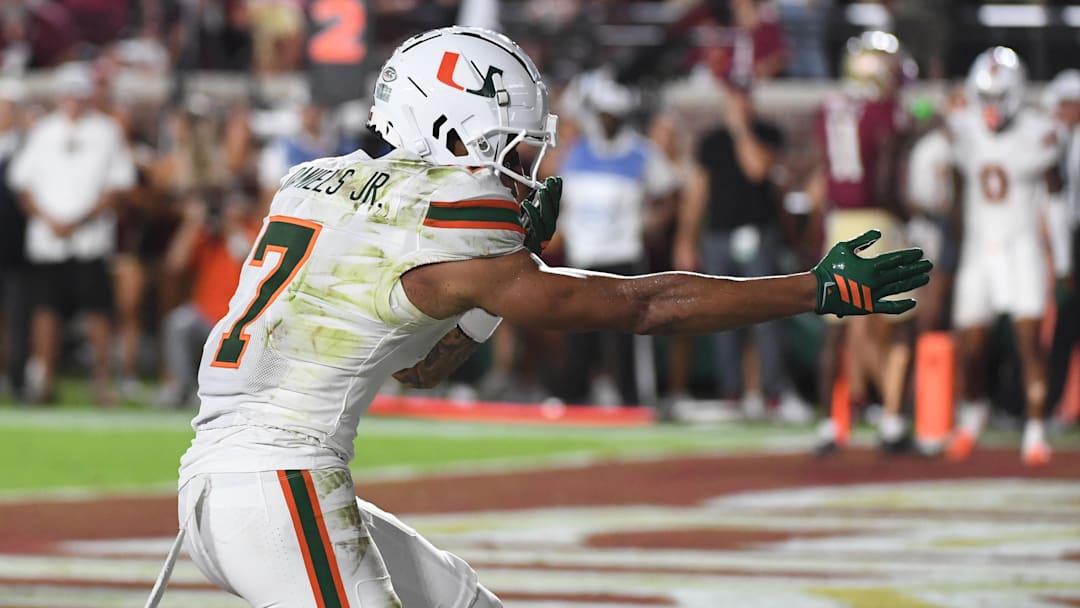 Oct 4, 2025; Tallahassee, Florida, USA; Miami Hurricanes wide receiver CJ Daniels (7) celebrates after a touchdown during the first half against the Florida State Seminoles at Doak S. Campbell Stadium. Mandatory Credit: Robert Myers-Imagn Images