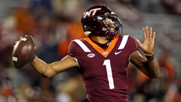 Nov 18, 2023; Blacksburg, Virginia, USA; Virginia Tech Hokies quarterback Kyron Drones (1) throws a pass against the North Carolina State Wolfpack at Lane Stadium. Mandatory Credit: Peter Casey-USA TODAY Sports