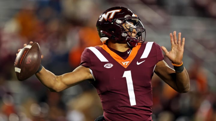 Nov 18, 2023; Blacksburg, Virginia, USA; Virginia Tech Hokies quarterback Kyron Drones (1) throws a pass against the North Carolina State Wolfpack at Lane Stadium. Mandatory Credit: Peter Casey-USA TODAY Sports