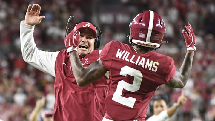 Sep 7, 2024; Tuscaloosa, Alabama, USA;  Alabama Crimson Tide wide receiver Ryan Williams (2) celebrates an assistant coach after scoring a touchdown agains the South Florida Bulls at Bryant-Denny Stadium. Alabama won 42-16. Mandatory Credit: Gary Cosby Jr.-Imagn Images