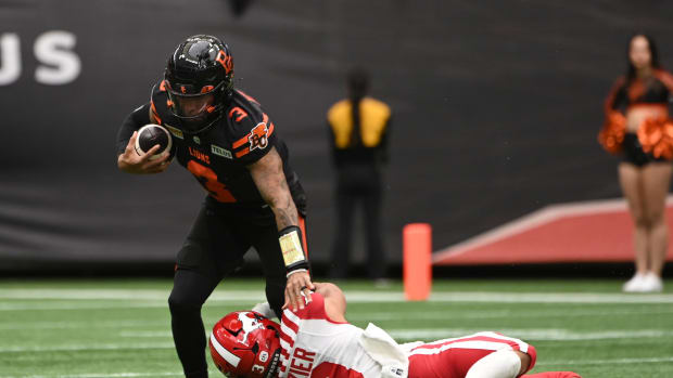 Jun 15, 2024; Vancouver, British Columbia, CAN; BC Lions quarterback Vernon Adams Jr (3) makes a catch during the first half against Calgary Stampeders defensive back Branden Dozier (3) at BC Place. Mandatory Credit: Simon Fearn-USA TODAY Sports