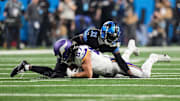 Detroit Lions safety Kerby Joseph (31) tackles Minnesota Vikings tight end T.J. Hockenson (87) during the first half at Ford Field in Detroit on Sunday, Jan. 5, 2025.
