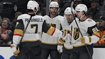 Dec 4, 2024; Anaheim, California, USA;  Vegas Golden Knights right wing Alexander Holtz (26) celebrates scoring a goal with defenseman Alex Pietrangelo (7), defenseman Noah Hanifin (15) and left wing Tanner Pearson (70) against the Anaheim Ducks during the third period at Honda Center. Mandatory Credit: Alex Gallardo-Imagn Images