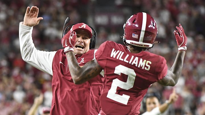 Sep 7, 2024; Tuscaloosa, Alabama, USA;  Alabama Crimson Tide wide receiver Ryan Williams (2) celebrates an assistant coach after scoring a touchdown agains the South Florida Bulls at Bryant-Denny Stadium. Alabama won 42-16. 