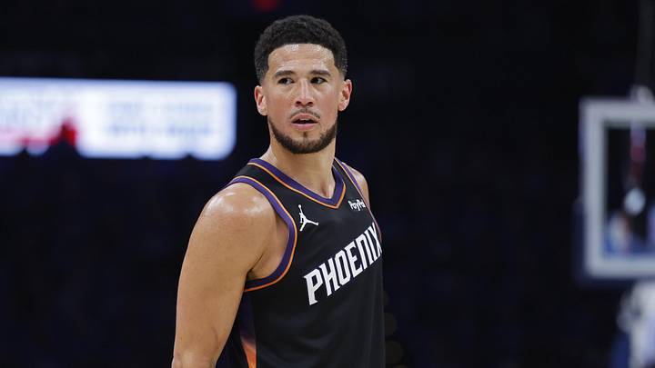Apr 19, 2026; Oklahoma City, Oklahoma, USA; Phoenix Suns guard Devin Booker (1) looks down the court against the Oklahoma City Thunder in the second half during game one of the first round of the 2026 NBA Playoffs at Paycom Center. Mandatory Credit: Alonzo Adams-Imagn Images