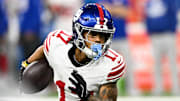 Nov 23, 2025; Detroit, Michigan, USA; New York Giants wide receiver Wan'Dale Robinson (17) runs upfield after catching a swing pass in the second quarter against the Detroit Lions at Ford Field.  