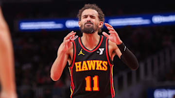 Jan 23, 2025; Atlanta, Georgia, USA; Atlanta Hawks guard Trae Young (11) reacts to a foul call by referee Pat Fraher (not pictured) against the Toronto Raptors in the fourth quarter at State Farm Arena. Mandatory Credit: Brett Davis-Imagn Images