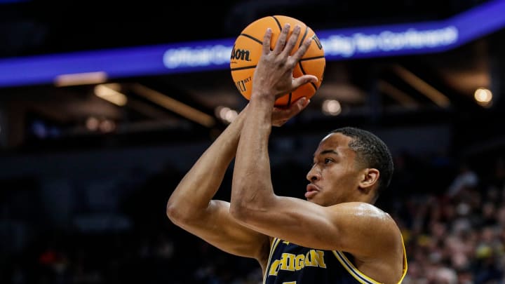 Michigan guard Nimari Burnett (4) attempts a jump shot against Penn State during the first half of the First Round of Big Ten tournament at Target Center in Minneapolis, Minn. on Wednesday, March 13, 2024.