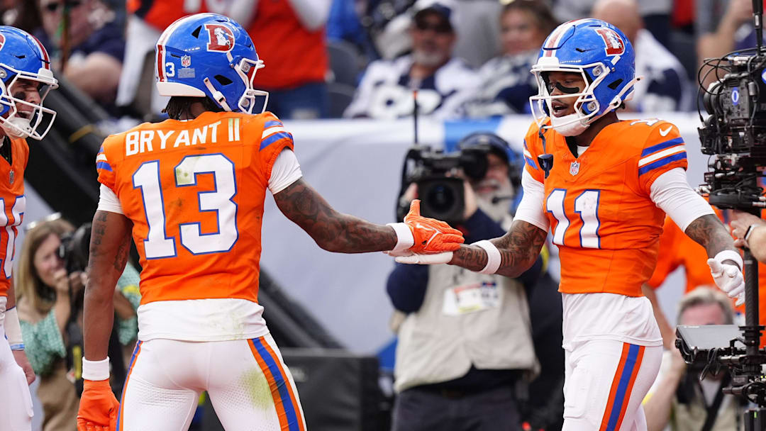 Oct 26, 2025; Denver, Colorado, USA;  Denver Broncos wide receiver Troy Franklin (11) celebrates with wide receiver Pat Bryant (13) after scoring a touchdown against the Dallas Cowboys in the fourth quarter at Empower Field at Mile High. 