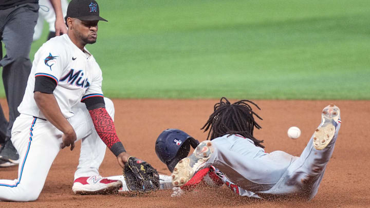 Sep 3, 2024; Miami, Florida, USA;  Washington Nationals shortstop CJ Abrams (5) steals second base as Miami Marlins shortstop Xavier Edwards (63) covers on the play during the eighth inning at loanDepot Park.