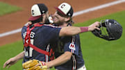 Sep 12, 2025; Cleveland, Ohio, USA; Cleveland Guardians catcher Austin Hedges (27) and starting pitcher Tanner Bibee (28) celebrate a win over the Chicago White Sox at Progressive Field. Mandatory Credit: David Richard-Imagn Images