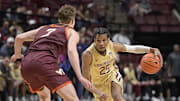 Jan 29, 2025; Tallahassee, Florida, USA; Florida State Seminoles guard Justin Thomas (25) drives to the net past Virginia Tech Hokies guard Brandon Rechsteiner (7) during the first half at Donald L. Tucker Center. Mandatory Credit: Melina Myers-Imagn Images