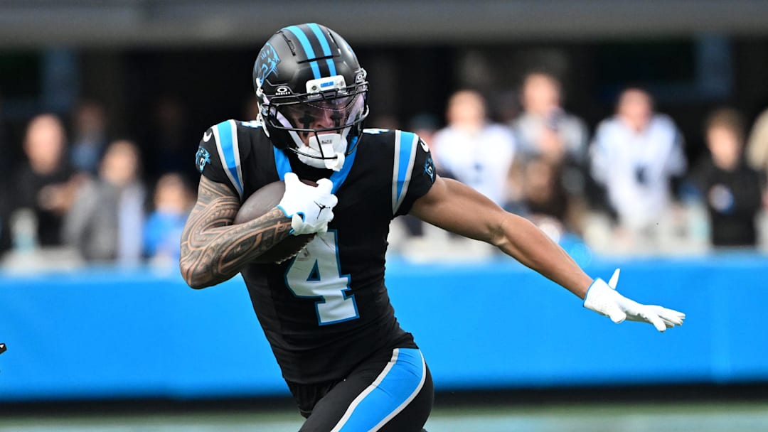 Dec 21, 2025; Charlotte, North Carolina, USA; Carolina Panthers wide receiver Tetairoa McMillan (4) with the ball in the third quarter at Bank of America Stadium. Mandatory Credit: Bob Donnan-Imagn Images